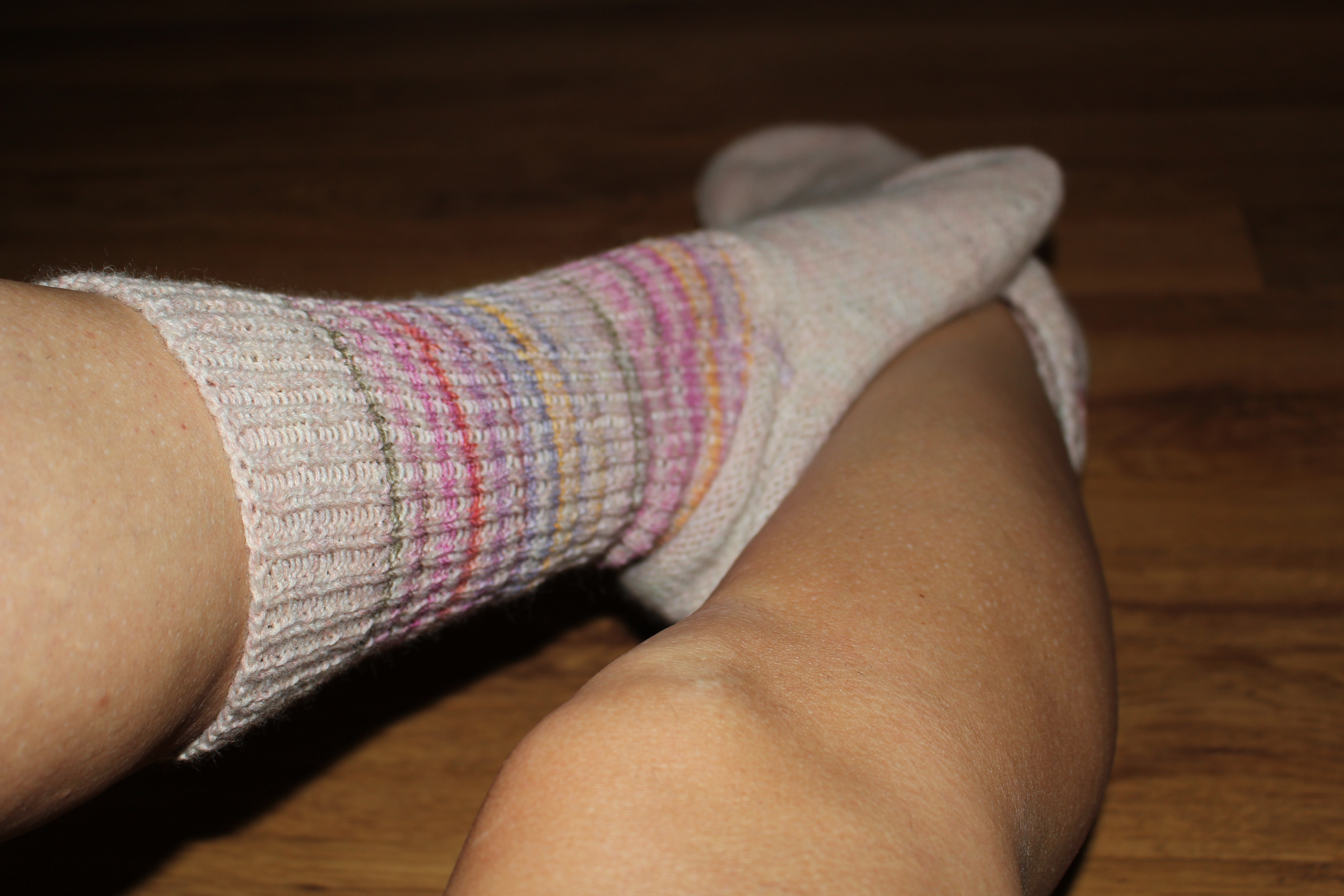 Cozy Vibes Only: Warm Socks, Wooden Floor, And A Little Playful Energy